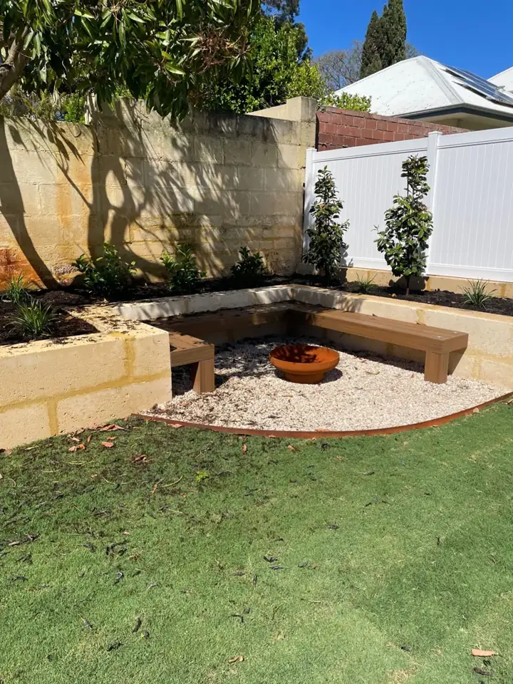 Corner timber seat around a fire pit
